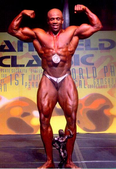 Pat Warner's front double biceps pose at the 2002 EFBB Mansfield Classic